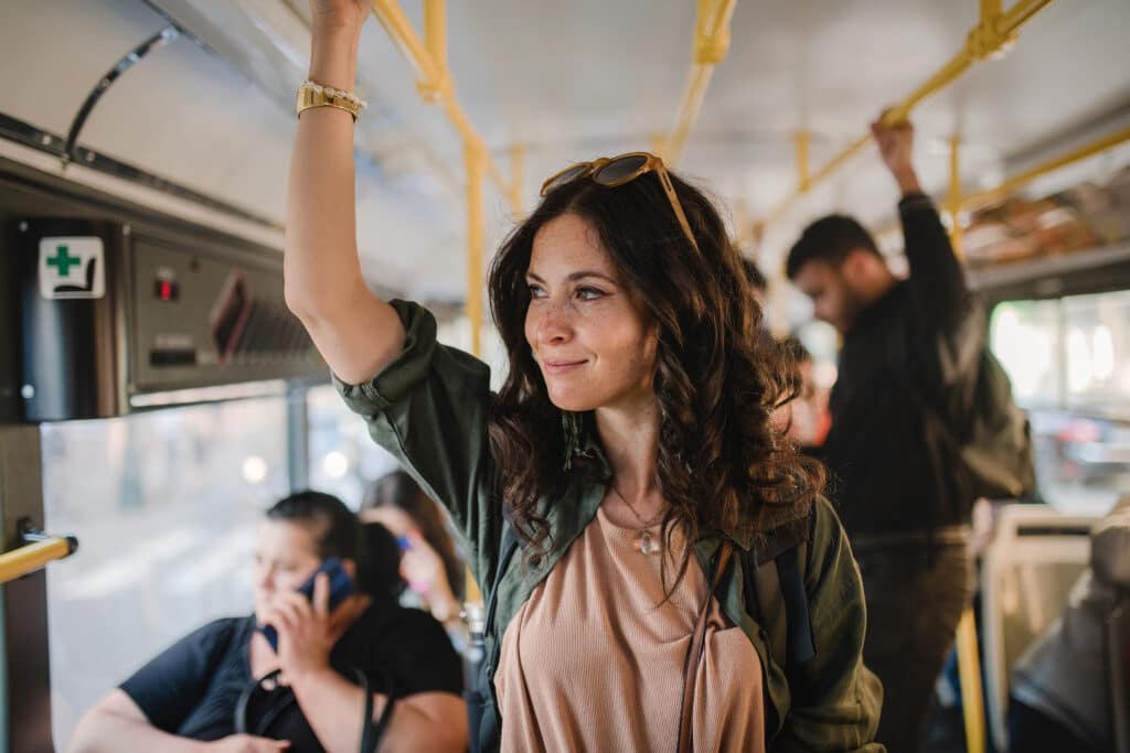 Woman riding bus transit.